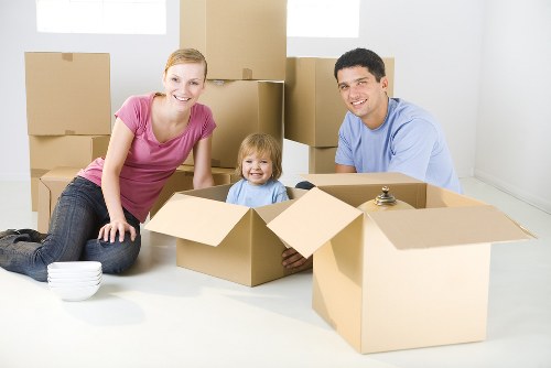 Removal van and moving boxes in a London residential street