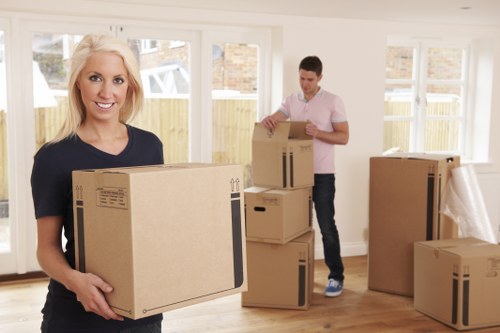 Man with van loading household items for a London removal