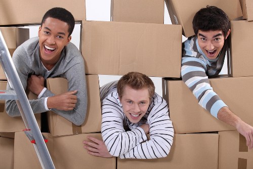 Loading furniture and boxes into a van for a London move