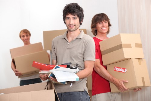 Packed office furniture and boxes ready for a business move in London