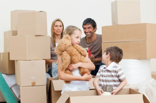 Removal team transporting furniture for a London home or office